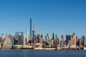 New York City skyline from New Jersey over the Hudson River with the skyscrapers at day time. Manhattan, Midtown, NYC, USA. A vibrant business neighborhood