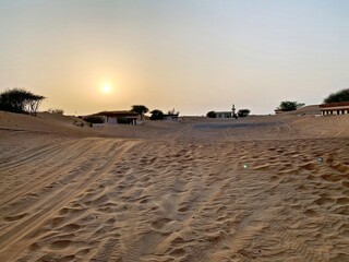 Sunset over buried ghost town Al Madam, Sharjah, United Arab Emirates
