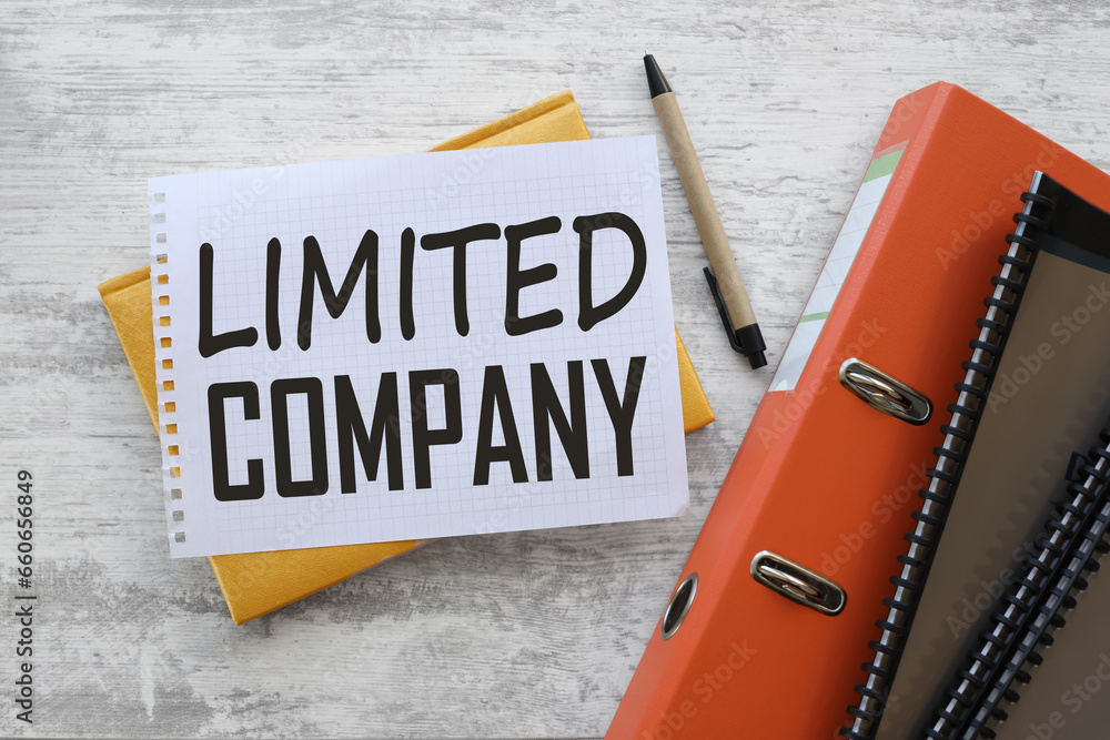 Poster limited company notepad page with text. on a yellow notepad