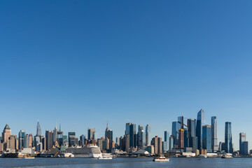 New York City skyline from New Jersey over the Hudson River with the skyscrapers of the Hudson Yards district at day time. Manhattan, Midtown, NYC, USA. A vibrant business neighborhood