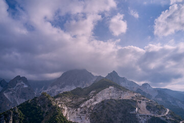 Fototapeta na wymiar Aerial panorama on the Carrara marble quarry. Aerial panorama of marble quarries Carrara Italy. Marble quarry top view.