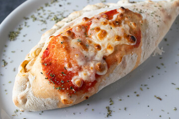 Close up of calzone pizza, Italian cuisine