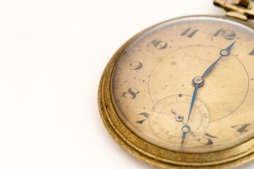 old broken pocket watch on white background