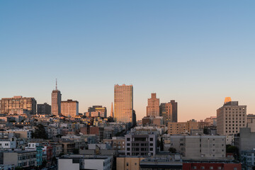 Panoramic cityscape view of San Francisco Nob hill area, which is historically known as a center of San Francisco upper class neighborhoods at golden hour, sunset, midtown, California, United States.