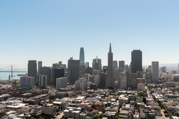 Panoramic view of San Francisco skyline at clear blue summer daytime from Coit Tower, Financial District and residential neighborhoods, California, United States.