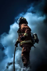 Tuinposter Firefighter against the background of smoke from the fire © LeonPhoto
