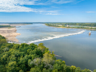 Low Water Dam and a rapid on the Mississippi RIver below Chain of Rocks with St Louis, Missouri, on the horizon