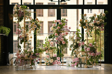 wedding arch of peonies and roses without people. Modern wedding decoration
