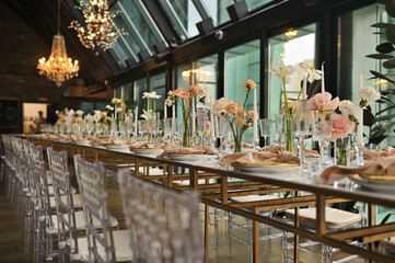 beautiful elegant decor of flowers and elegant serving on the wedding table. Modern wedding decoration