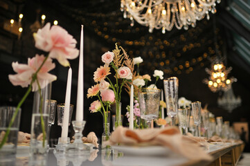 beautiful elegant decor of flowers and elegant serving on the wedding table. Modern wedding decoration