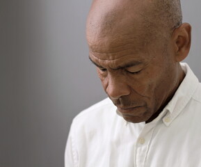  black man praying to god on gray background with people stock image stock photo