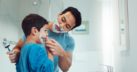 Fototapeta premium Shaving cream, child and father teaching in bathroom, family home or boy learning morning skincare, beauty and grooming routine. Shave together, son and dad helping with foam, razor and skin care