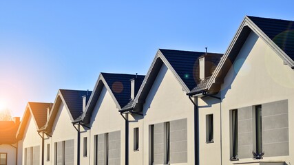 Suburban neighborhood with condominium complex. Suburban area with modern geometric family houses....