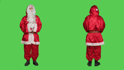 Man acting like santa in costume saying ho ho ho, portraying december famous character for...