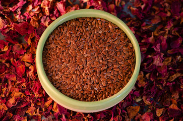 Sesame seeds with dried flowers.healthy seeds and dried roses