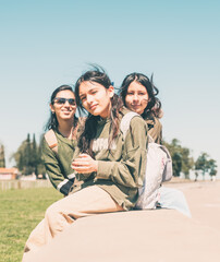 women sitting on the waterfront in the sun