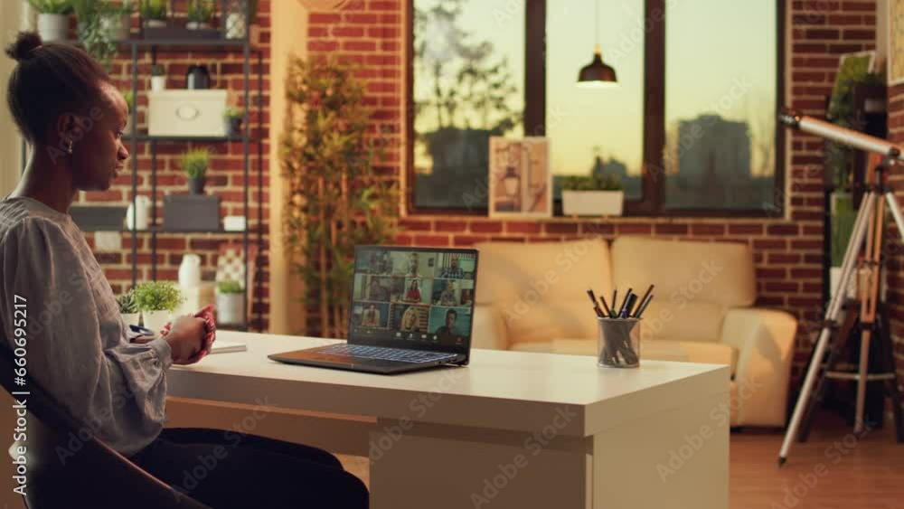 Poster freelancer attending online meeting on videocall, using network connection to talk about new tasks f