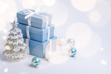 Obraz na płótnie Canvas Christmas blue gifts with decorations on white background