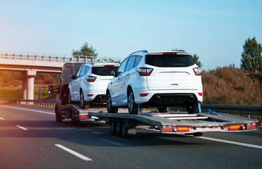 Safe Transportation of The Brand New White SUV Cars Seen On the Highway With the Help of Heavy Lift...