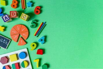 Colorful math fractions, numbers, letters on green background. Interesting, fun math for kids....