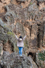 person standing on a rock