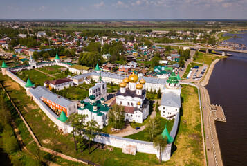View of male Ipatiev Monastery on bank of river in Russian city of Kostroma on sunny spring day