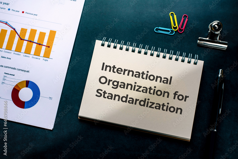 Poster there is notebook with the word international organization for standardization. it is as an eye-catc