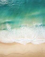 A birds eye view of the beach, with shades of blue and green blending together in the water. Ast the vibrant colors, there is a stark contrast in the form of the cross and the single set