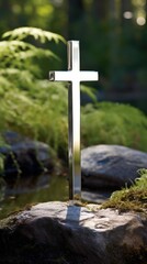 P on a pedestal, a simple stainless steel cross reflects the beauty of the surrounding garden, reminding visitors to look within and find peace and healing.