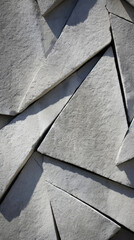 Closeup of a sharp and angular texture of bush hammered concrete, revealing its intricate patterns and sharp edges.