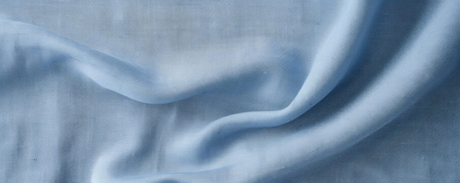 Texture of a rayon chambray fabric, with a tight crosshatch weave and a soft, denimlike feel. The fabric is smooth and has a matte finish.