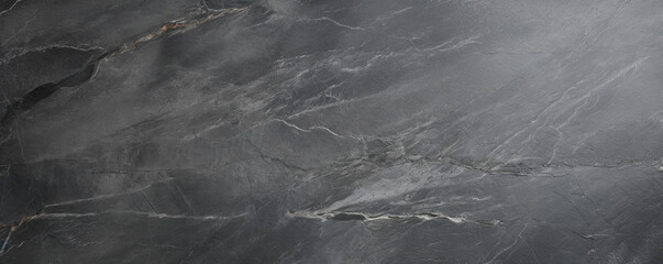 Texture of antique soapstone with a satin patina In this image, the aged soapstone has a beautiful satin patina that gives it an antique look. The stone has a weathered appearance, with