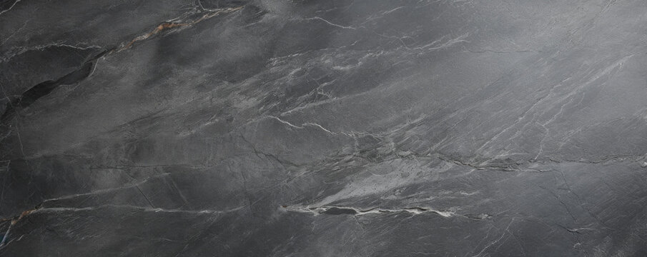 Fototapeta Texture of antique soapstone with a satin patina In this image, the aged soapstone has a beautiful satin patina that gives it an antique look. The stone has a weathered appearance, with