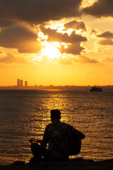 fishing at sunset