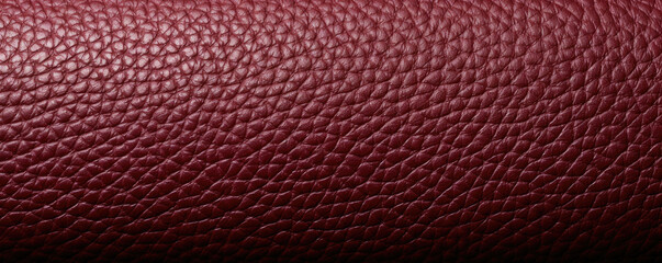 Closeup of a FullGrain Leather texture in a warm burgundy shade, showcasing its unique and individual grain pattern. This type of leather is known for its ability to develop a rich patina - obrazy, fototapety, plakaty