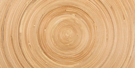Plexiglas foto achterwand The abstract circular wooden bamboo texture background. © zhikun sun