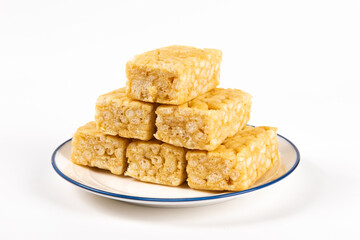 Chinese traditional dessert caramel treats or sachima isolated on white background.