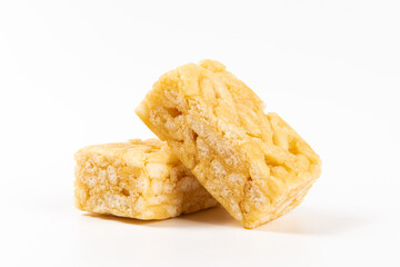 Chinese traditional dessert caramel treats or sachima isolated on white background.