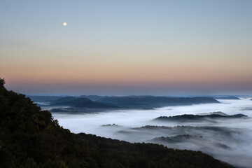 Full Moon and Fog in Mountains