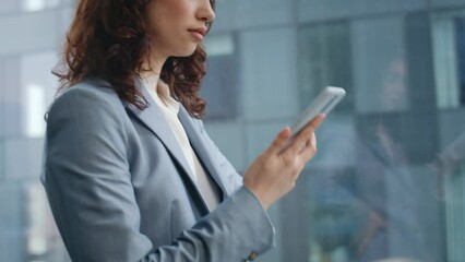 Company worker answering call at office window close up. Girl talking telephone