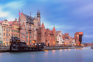 Fototapeta premium City embankment and facades of medieval houses in the old town on a sunny morning, Gdansk, Poland