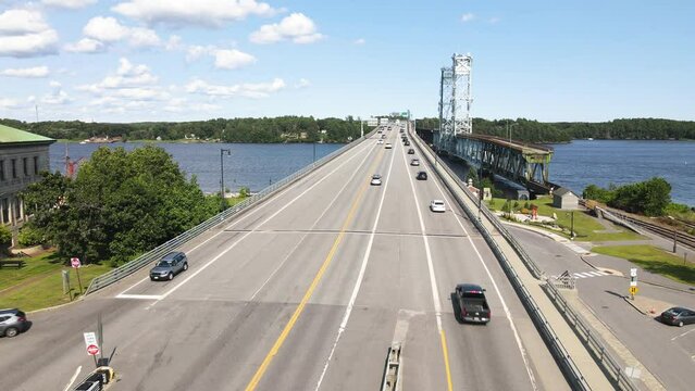Drone footage showing traffic on the RTE 1 highway bridge crossing at the City of Bath in Maine.  Static aerial shot.