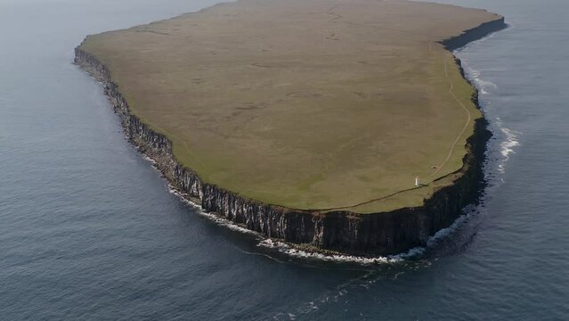 Fontur Lighthouse At The End Of Langanes Peninsula Surrounded By Calm Sea In Iceland. - aerial