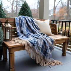  navy bench with flannel blanket
