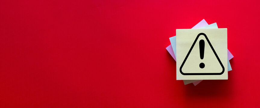 Attention,Danger,Sign,caution mark concept.,Exclamation mark or Warning sign in yellow stickny note on red background with copyspace idea for Hazard warning.