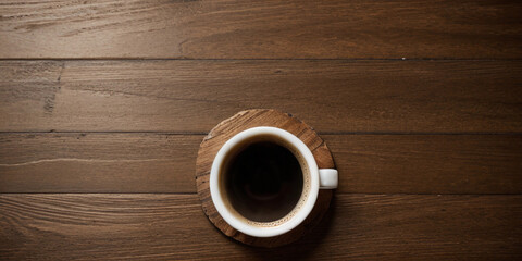 Top view of a cup of coffee on the wooden table, coffee background with copy space