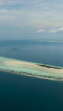 Aerial drone of Timba Timba island with beach and coral reef. Tun Sakaran Marine Park. Borneo, Sabah, Malaysia.