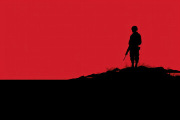 Fototapeta premium Silhouette of a soldier on a hill with a red sky