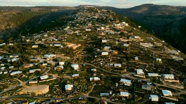settlement in Israel In Gush Etzion near Hebron.
Bat Ha'Ein is an ecological settlement, light construction to preserve nature.
In the background are the Gush Etzion mountains. 
aerial drone view.