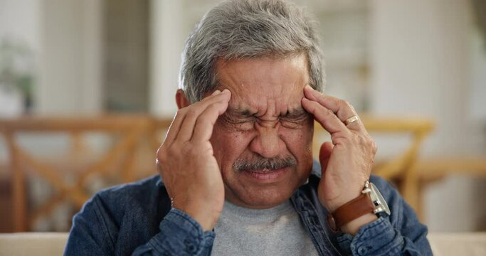 Senior man, stress and headache in home for retirement, mental health and anxiety of depression. Face of tired elderly pensioner massage temple for vertigo, worry and crisis of pain, debt and mistake